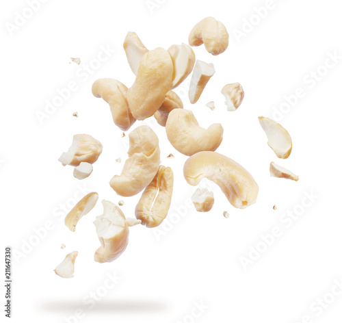 Cashew crushed into many pieces close-up isolated on white background photo
