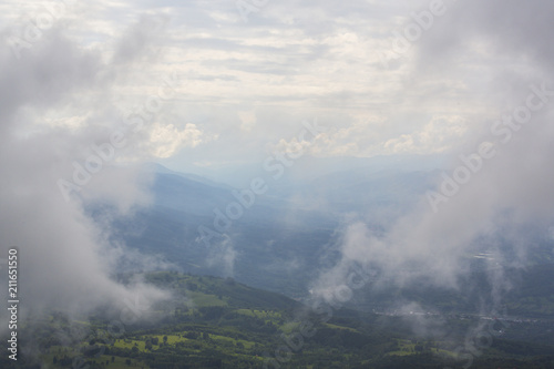Summer scenery in the mountains, with rain and mist clouds