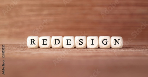 Valokuva Word REDESIGN made with wood building blocks