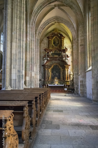 Inside the ancient Catholic temple, a series of rocks in front of the altar and high ceilings