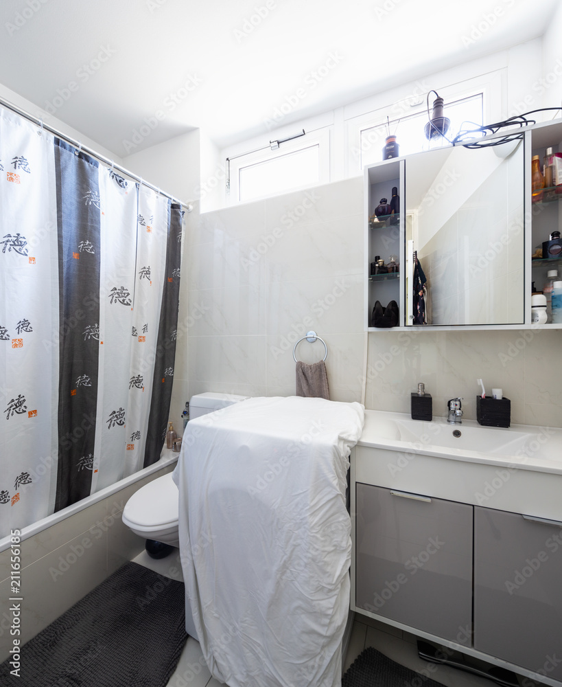 Fototapeta Bathroom with tile, sink and shower