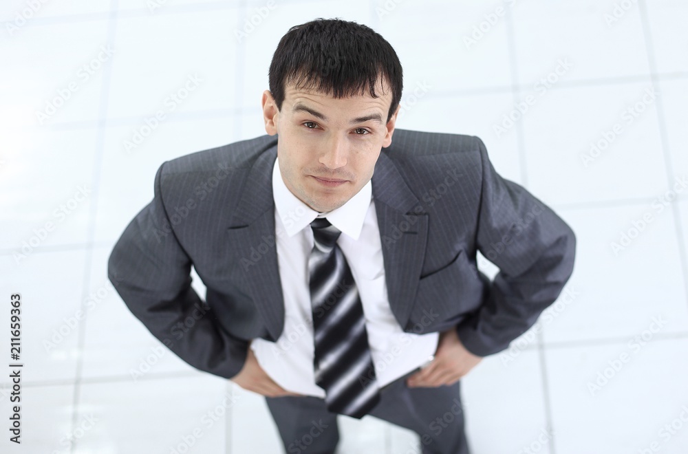 view from the top: portrait of smiling businessman