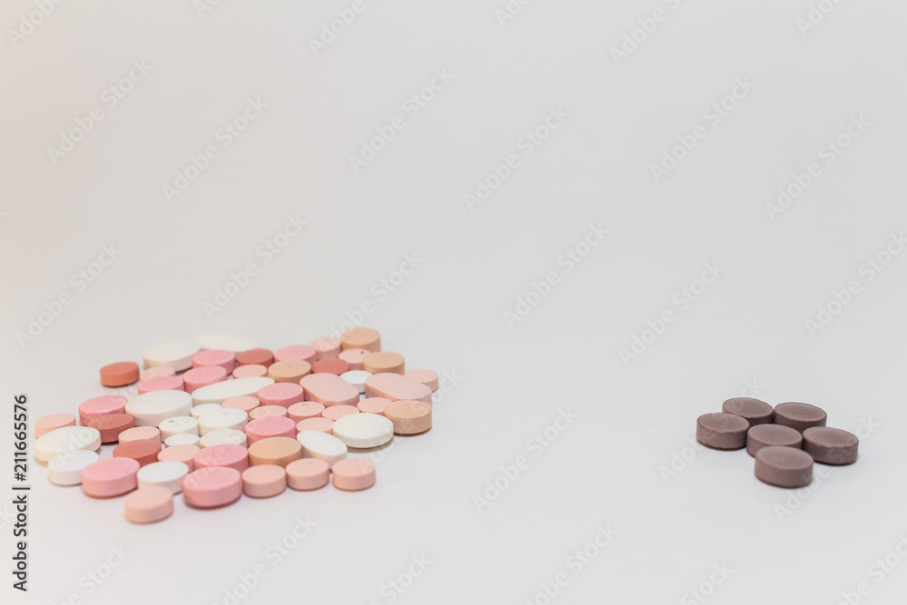 Numerous medicines Medications in the form of tablets. Colored pills on a white background. Numerous medicines Medications in the form of tablets. Colored pills on a white background.