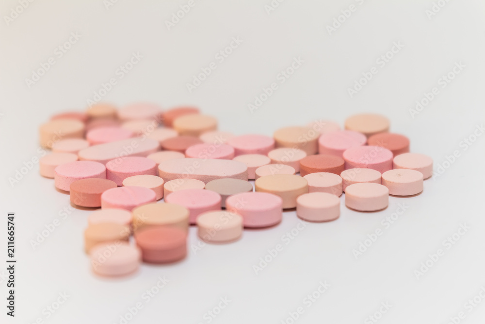 Numerous medicines Medications in the form of tablets. Colored pills on a white background. Numerous medicines Medications in the form of tablets. Colored pills on a white background.