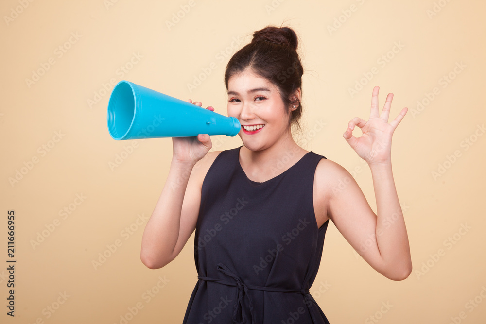 Beautiful young Asian woman show OK announce with megaphone. Beautiful young Asian woman show OK announce with megaphone.