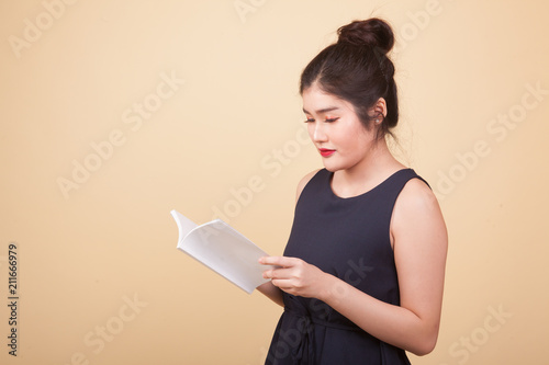 Young Asian woman read a book.