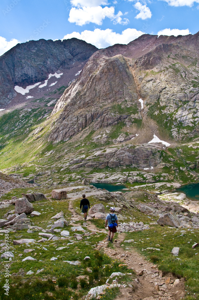 Men hiking, Twin Lakes Basin, Weminuche Wilderness, Needle Range, San Juan National Forest, Colorado, Mount Eolus in background, MR