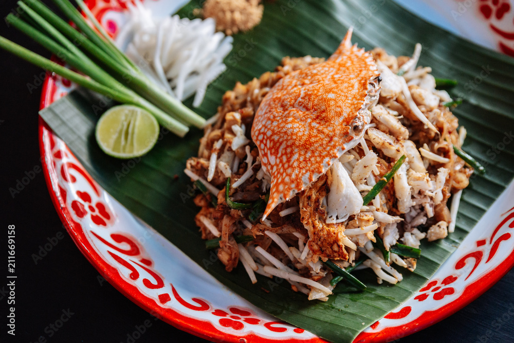 Crab Pad Thai served with lime, scallions, bean sprouts. crushed peanut and chili powder. Crab Pad Thai served with lime, scallions, bean sprouts. crushed peanut and chili powder.