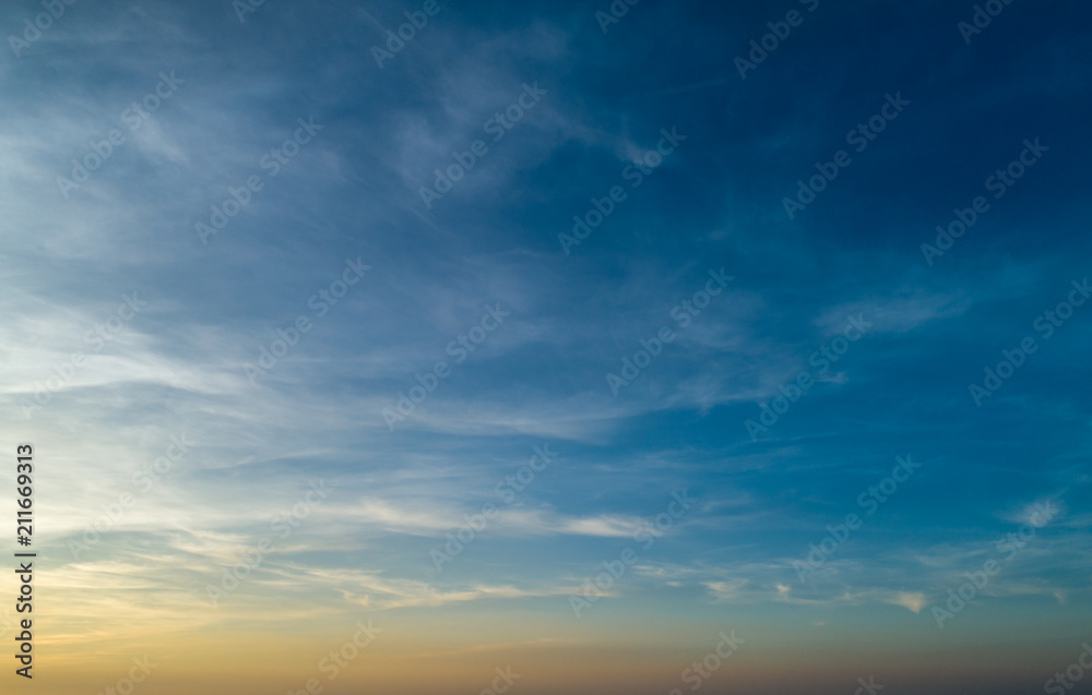 Beautiful sunset sky with clouds and orange strip along the horizon. Beautiful sunset sky with clouds and orange strip along the horizon.