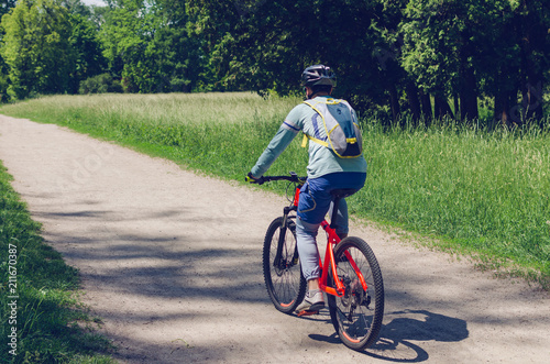 The cyclist in motion riding bicycle road