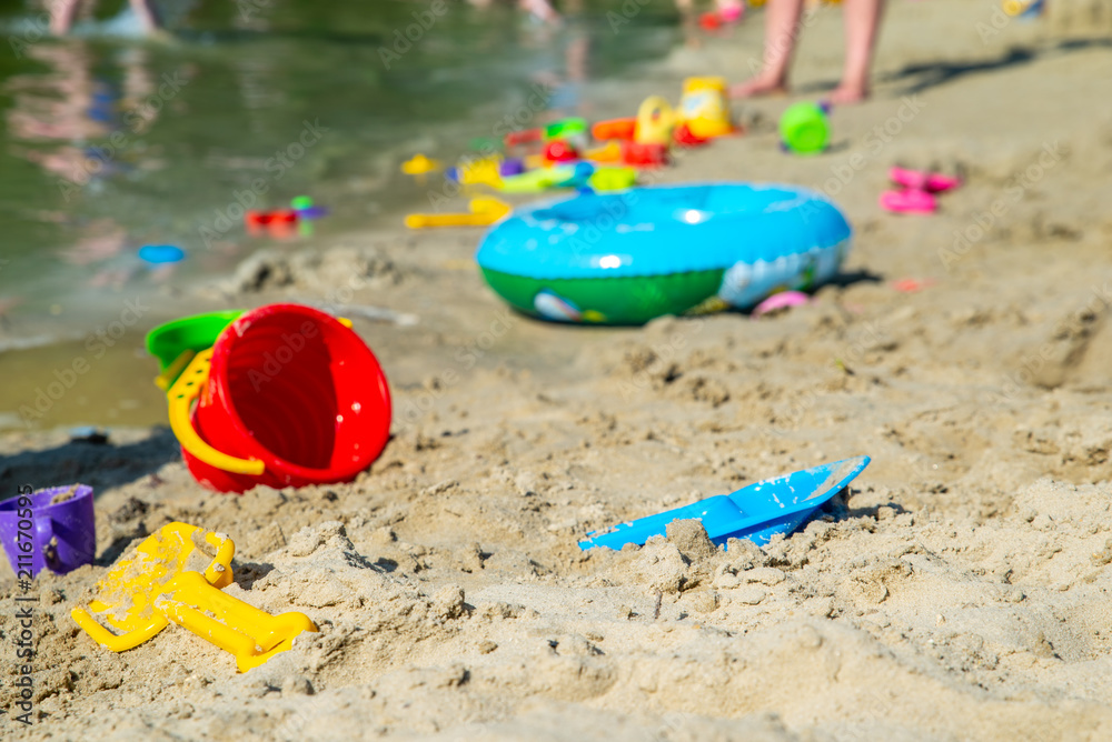 inflatable ring kids toys at sand beach close up. nobody inflatable ring kids toys at sand beach close up. nobody