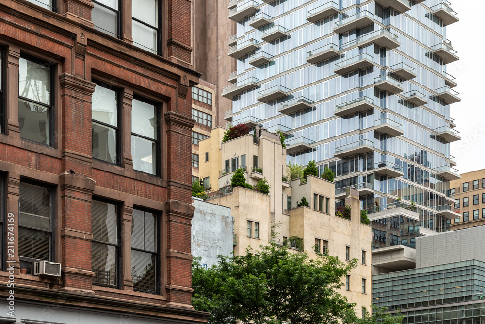 Naklejka premium New York City / USA - JUN 27 2018: TriBeCa streets, and buildings facade, store, restaurant and cafe and apartments in Manhattan