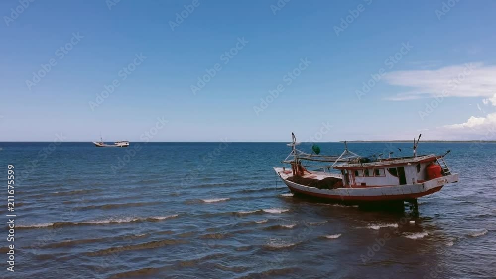 Phinisi Traditional Wooden Boat sailing the ocean aerial fly by panning shot Phinisi Traditional Wooden Boat sailing the ocean aerial fly by panning shot