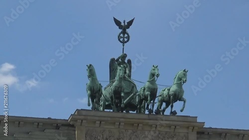 A statue on the top of Brandenburg gate in Berlin photo