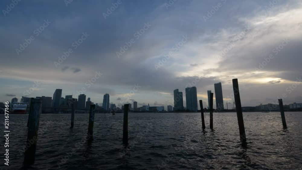 Sunset time lapse of Miami city with drone flying past in Florida, USA Sunset time lapse of Miami city with drone flying past in Florida, USA