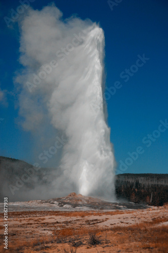 Old Faithful Geyser erupts at Yellowstone National Park