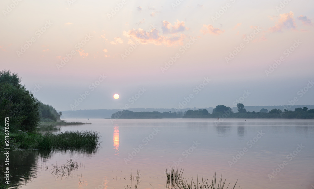 Morning on a river with fog, fishing