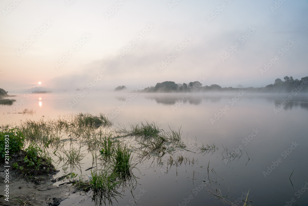 Morning on a river with fog, fishing