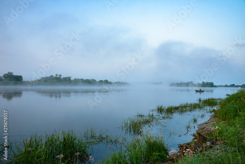 Morning on a river with fog, fishing