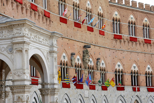 SIENA, ITALY - AUGUST 16, 2008: Piazza del Campo is the main square of Siena with view on Palazzo Pubblico and its Torre del Mangia.
