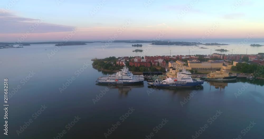Ice breakers, C4k aerial view around ice-breakers at katajanokka bay, on a sunny summer morning dawn, in Helsinki, Uusimaa, Finland