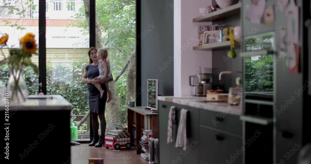 Pregnant mother with child looking outdoors Pregnant mother with child looking outdoors
