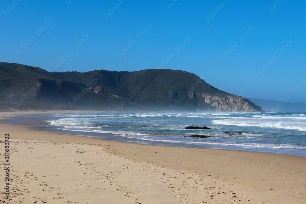 A landscape image of Nature's Valley beach in the Western Cape, South Africa. This is a popular holiday destination on the Garden Route. A landscape image of Nature's Valley beach in the Western Cape, South Africa. This is a popular holiday destination on the Garden Route.