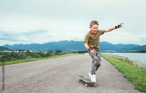Boy learn to skate on skateboard