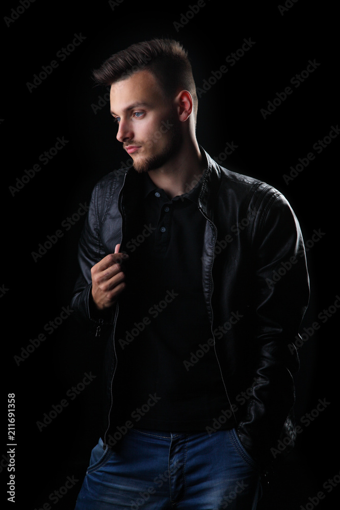 man on a black background / young man on a black background in a leather jacket man on a black background / young man on a black background in a leather jacket