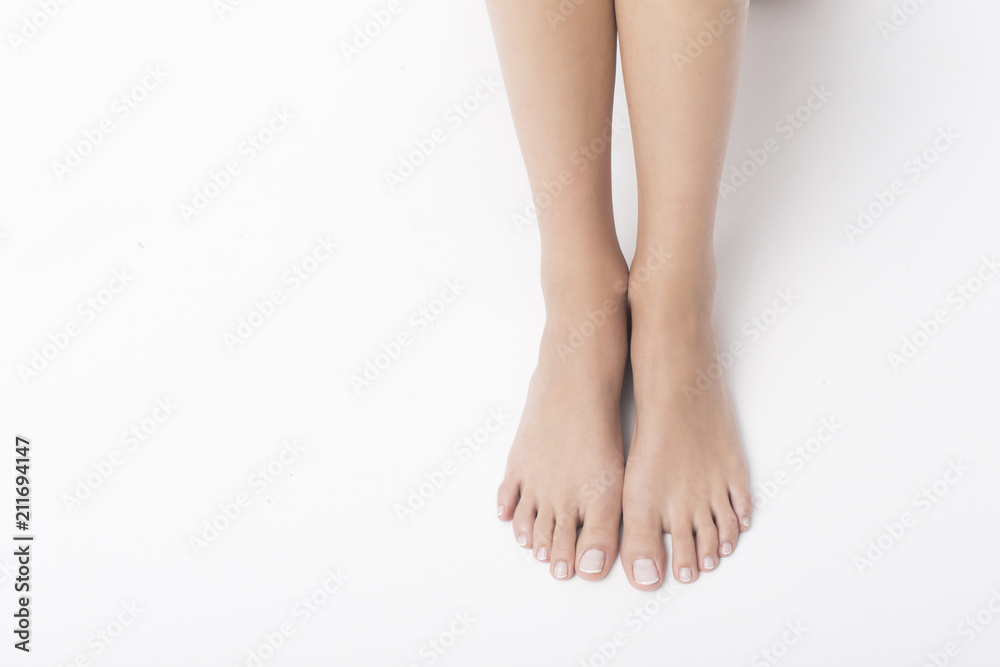 Beautiful legs and hands on white background. Pedicure and manicure time. Beautiful legs and hands on white background. Pedicure and manicure time.