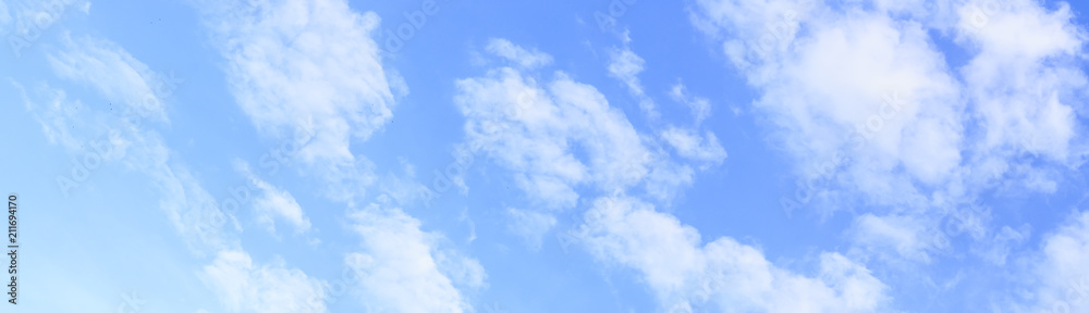 panoramic of blue sky and white clouds, gradient of blue.