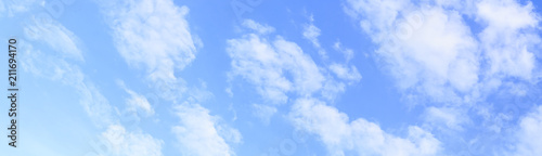 panoramic of blue sky and white clouds, gradient of blue.