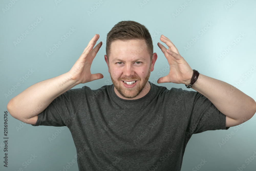 Frustrated angry man snarling and gesturing Frustrated angry man snarling and gesturing