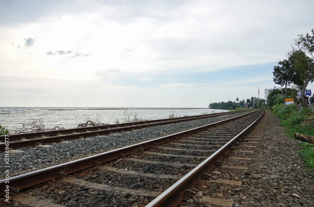 Coastal railway tracks along the ocean. The coast of Sri Lanka