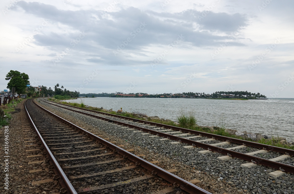 Coastal railway tracks along the ocean. The coast of Sri Lanka