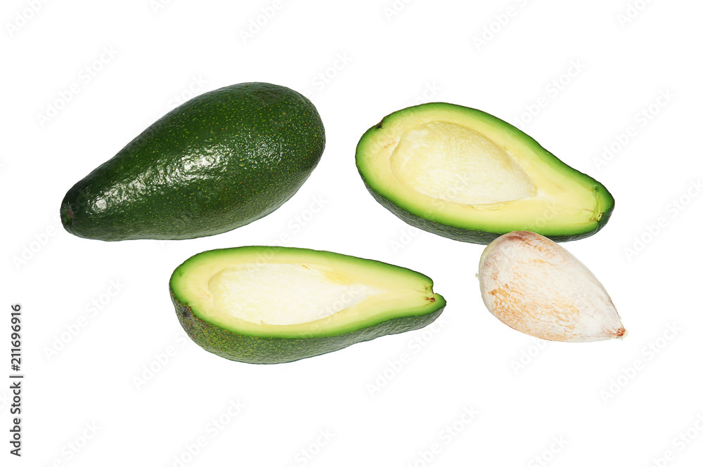 Two avocado, the whole, cut in half and bone on white background, isolated Two avocado, the whole, cut in half and bone on white background, isolated