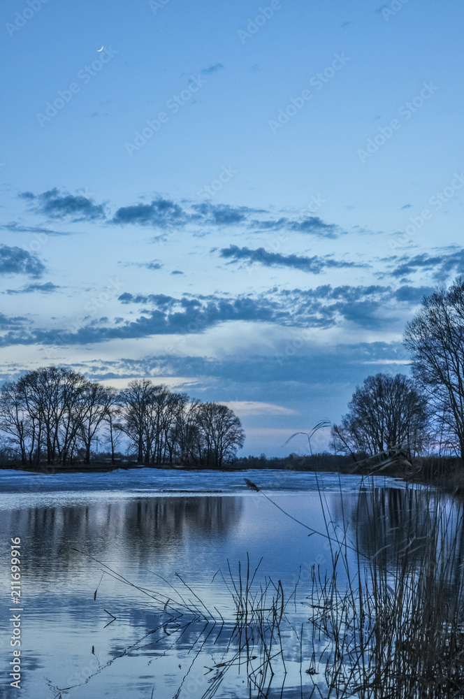 Beautiful scenery sunset on the lake in early spring. Beautiful scenery sunset on the lake in early spring.