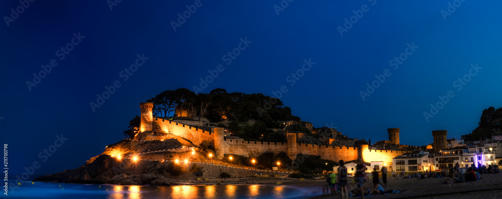 Beautiful castle in front of the Mediterranean Sea during the blue hour