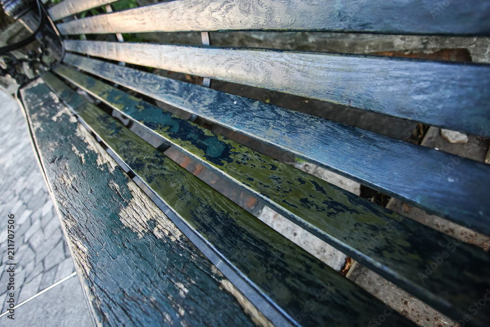 close up peeling paint on wooden bench, top view in selective focus close up peeling paint on wooden bench, top view in selective focus
