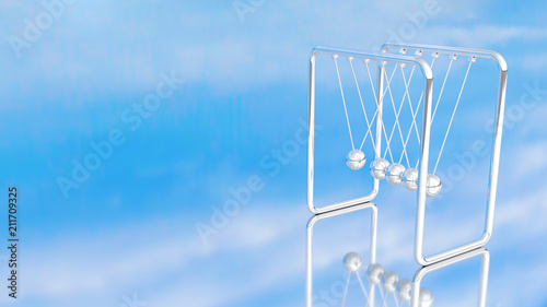 Newtons cradle or Pendulum blue sky background