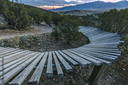 Curve of a wooden berm at sunset