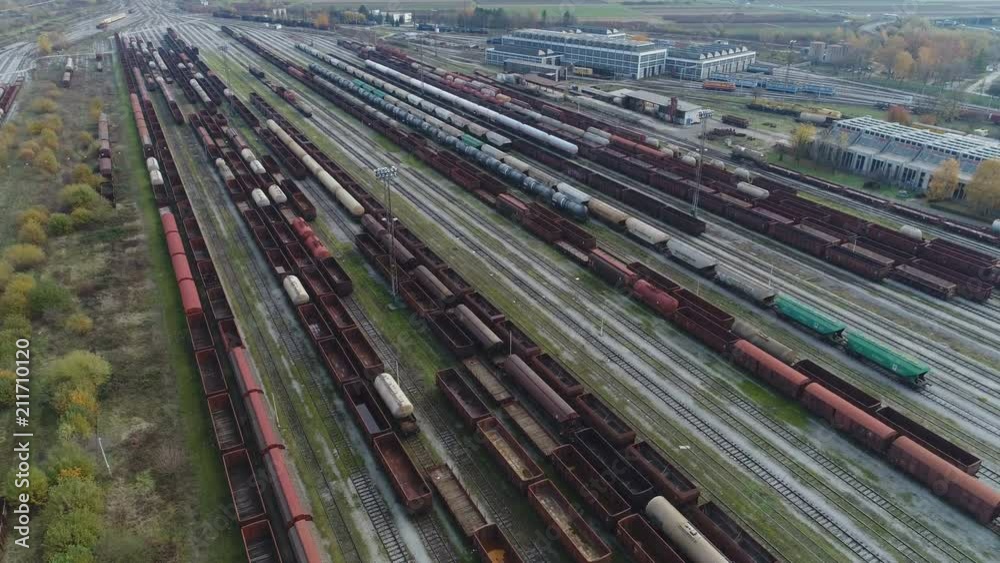 Tilting drone shot of cargo trains and petrochemical tankers on tracks of depot in Zagreb, heavy industrial zone in Croatia Tilting drone shot of cargo trains and petrochemical tankers on tracks of depot in Zagreb, heavy industrial zone in Croatia