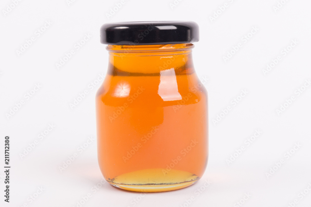 Honey bottle isolated on white background Honey bottle isolated on white background