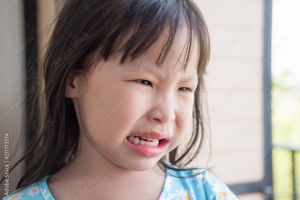 Little asian girl crying with running nose Little asian girl crying with running nose