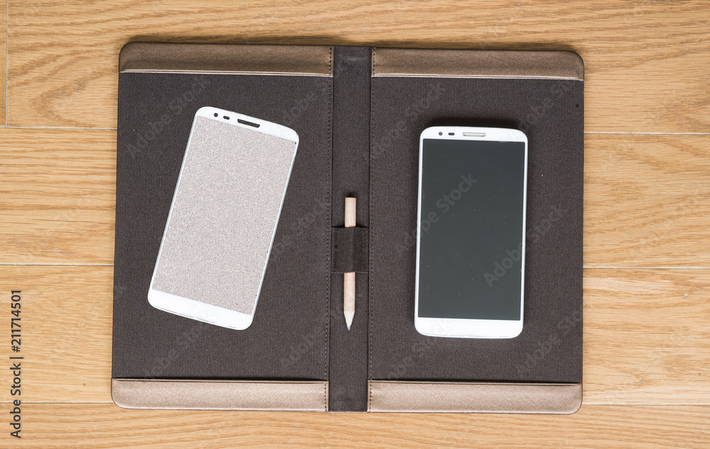 Smartphone near pencil on pad. Smartphone near pencil on pad.