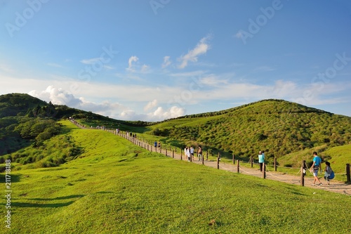 Qingtiangang Grassland in Taipei Yangmingshan,Taiwan.Photo taken on: JULY 1,2018,Shooting spot of Qingtiangang Grassland in Taipei Yangmingshan,Taiwan R.O.C. People are tourists.
