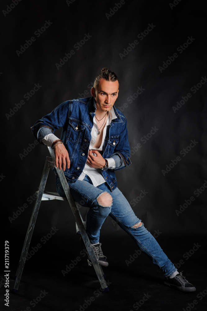 Fototapeta premium Young handsome man in jeans