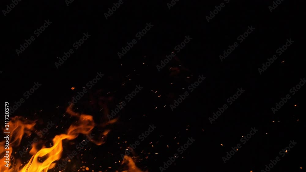 Fire in nature. Bokeh from the fire. Blurred backgrounds. Space views. Sparks are beautifully flying right at you. Shooting speed 60fps, slow motion. Live shooting of the most beautiful flame.
