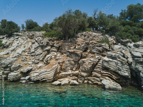 Stone shore of Cleopatra island, Turkey island in the mediterranian sea