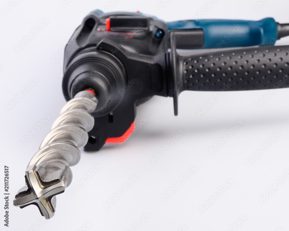 Electric drilling machine on a white background Electric drilling machine on a white background